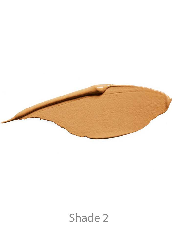 A creamy, medium beige swatch of 100% Pure 2nd Skin Concealer 5ml in Shade 2 on a white background, highlighting this vegan concealer’s natural finish.
