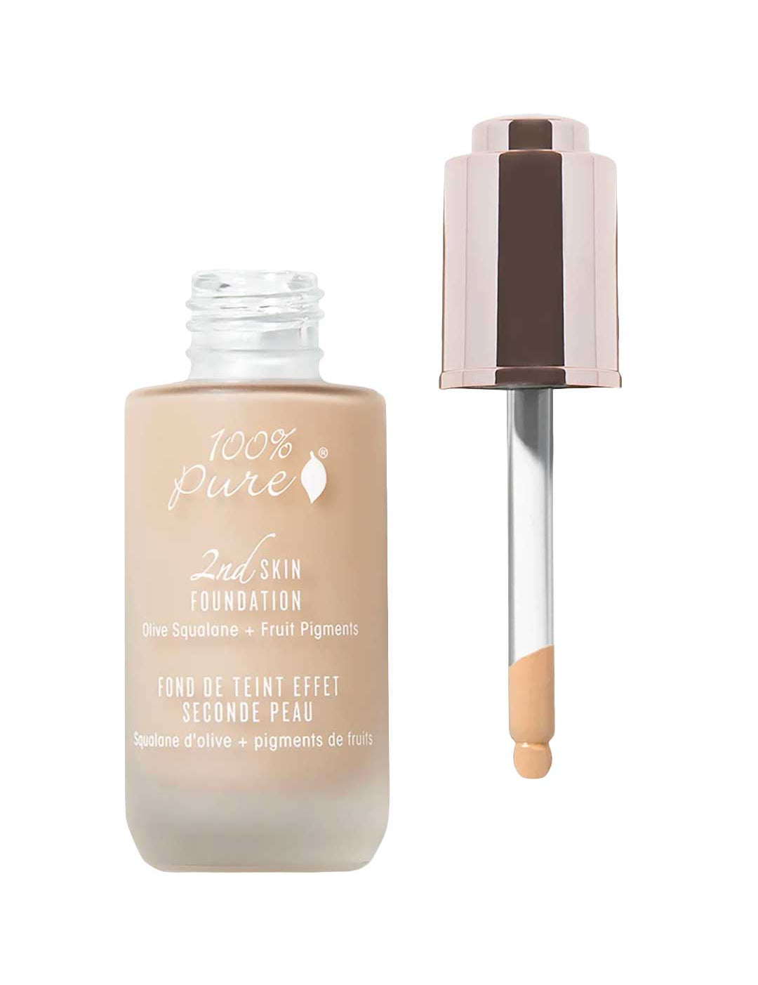 An open bottle of 100% Pure 2nd Skin Foundation 35ml with a dropper reveals beige serum foundation. The label features olive squalane and fruit pigments for a radiant, natural complexion.