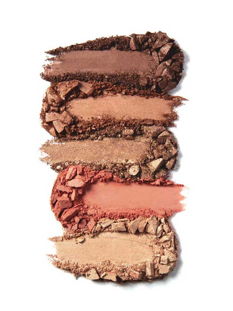 Five horizontal swatches from the 100% Pure Better Naked Palette 9g show warm, neutral vegan eyeshadow shades—ranging from deep brown to gold and peach—stacked on a white background.