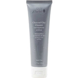 A gray 2.7 fl oz (80 ml) tube of 100% Pure Charcoal Clay Cleanser with white text, featuring pore minimizing and detoxifying benefits and a simple bamboo illustration.