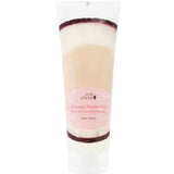 A 236ml tube of 100% Pure Coconut Shower Gel with a pink label and white cap, showing beige and white layers. This nourishing body wash suits sensitive skin, with English and French text on the label.