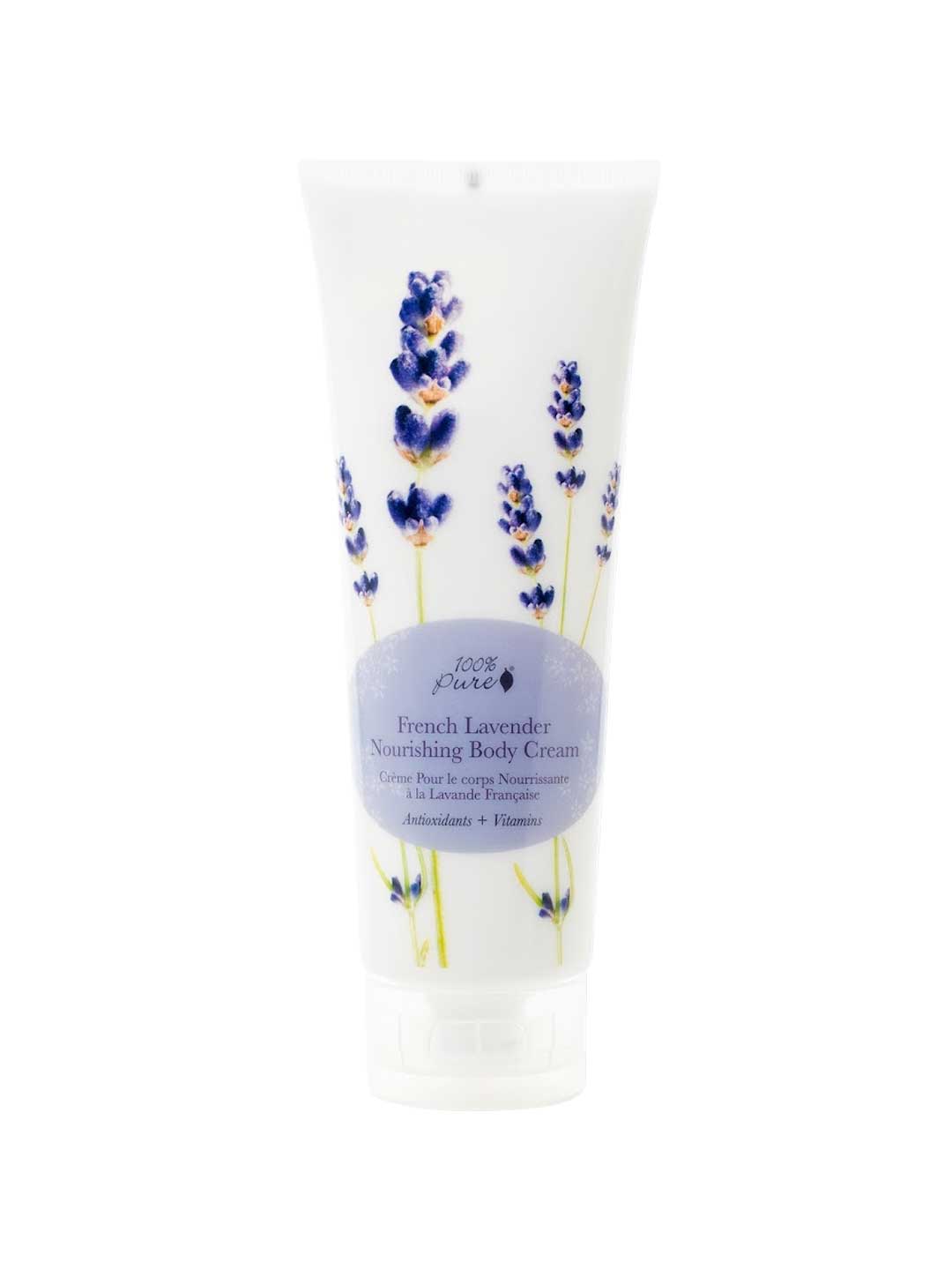 The 100% Pure French Lavender Nourishing Body Cream 236ml comes in a white tube with lavender flower illustrations and a light purple label, delivering deeply nourishing hydration for luxuriously soft skin.