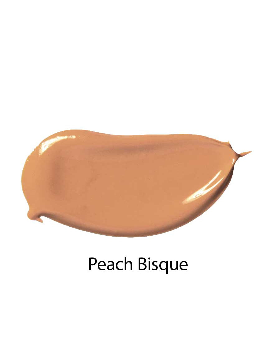 A smooth, curved swatch of 100% Pure Fruit Pigmented® Tinted Moisturiser 30ml in Peach Bisque is displayed on a white background, highlighting its natural coverage.