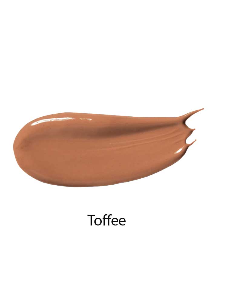 A smooth, glossy smear of medium brown 100% Pure Fruit Pigmented® Tinted Moisturiser 30ml in shade Toffee on a white background.