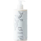 A white bottle of 100% Pure Glossy Locks Grow More Conditioner with a pump, featuring black botanical illustrations and simple, elegant text on the label.