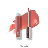 An open tube of 100% Pure Lip Gloss 4.17ml with its applicator wand and a mauve swatch behind, showing the vegan shade Mauvely. Enjoy a non-sticky shine by 100% Pure, shade name labeled underneath.