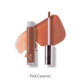 A 4.17ml tube of 100% Pure Lip Gloss in Pink Caramel with its applicator beside it, set against a caramel-pink swatch. Enjoy the vegan, non-sticky formula and flawless shine from 100% Pure.