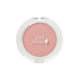 A round, pink pressed eye shadow compact with a clear lid shows "100% Pure" and a leaf logo on top. This vegan eye shadow features natural mineral shimmer. The 2g compact is viewed from above on a white background.