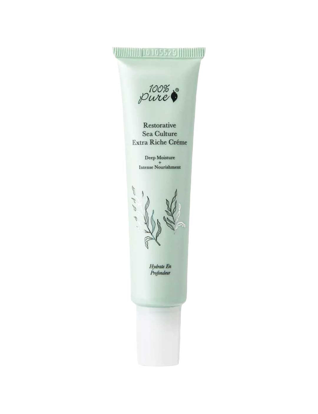 A light green 40ml tube of 100% Pure Restorative Sea Culture Extra Riche Créme features ocean plant art, black product details, and offers hydration with seaweed polysaccharides.
