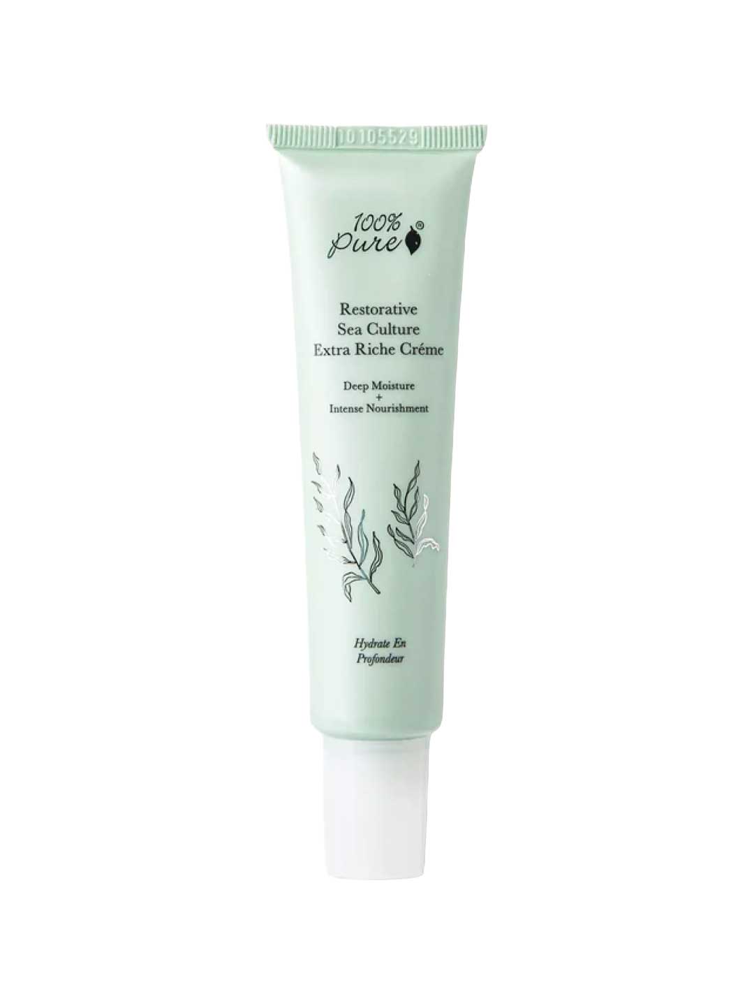 A light green 40ml tube of 100% Pure Restorative Sea Culture Extra Riche Créme features ocean plant art, black product details, and offers hydration with seaweed polysaccharides.