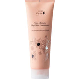 A peach-colored tube of 100% Pure Yuzu & Pomelo High Shine Conditioner, a sulfate-free conditioner featuring black text and botanical illustrations on the front.