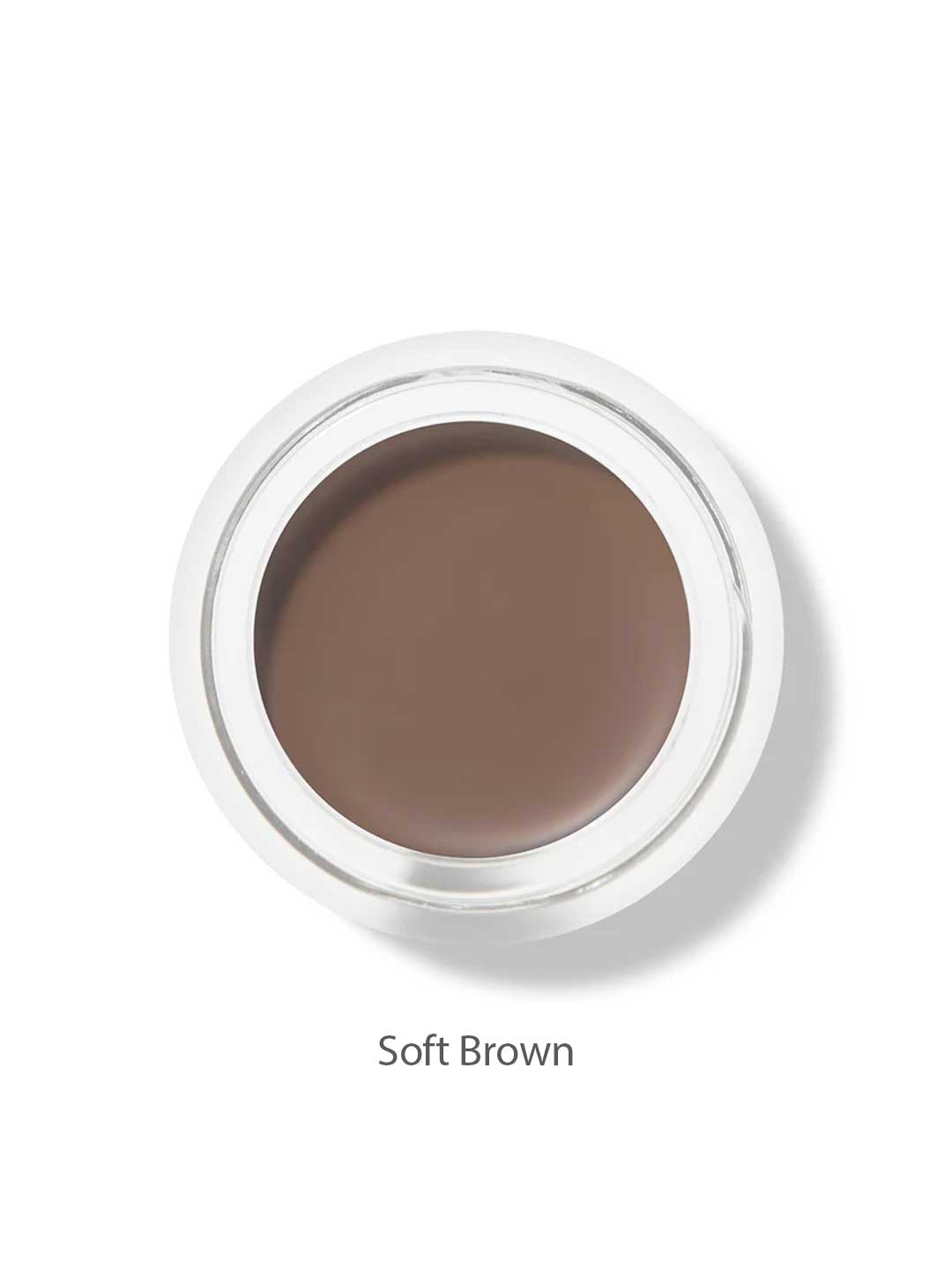 A round 100% Pure Long Last Brows 4.5g container with soft brown cream is shown from above, labeled Soft Brown. This vegan formula by 100% Pure also works as a natural brow gel for an effortless, long-lasting look.
