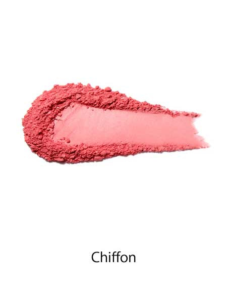 A smear of 100% Pure Rice Powder Pressed Blush 9g in the shade Chiffon is displayed on a white background, offering a natural flush and buildable coverage.