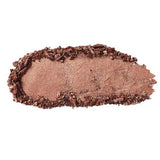 A smudge of shimmery rose gold 100% Pure Pressed Eye Shadow (2g) with a rough, uneven edge, set against a white background.