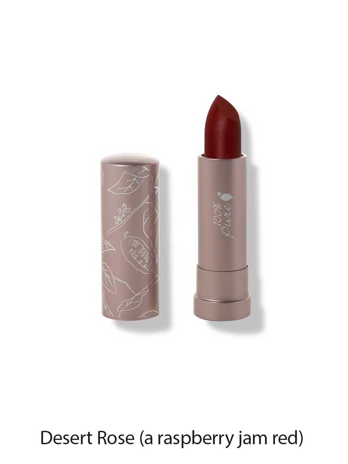 The 100% Pure Cocoa Butter Matte Lipsticks 4.5g is shown in a rosy mauve tube with white floral designs and the cap off, revealing a deep red shade. Text below reads: Desert Rose (a raspberry jam red).