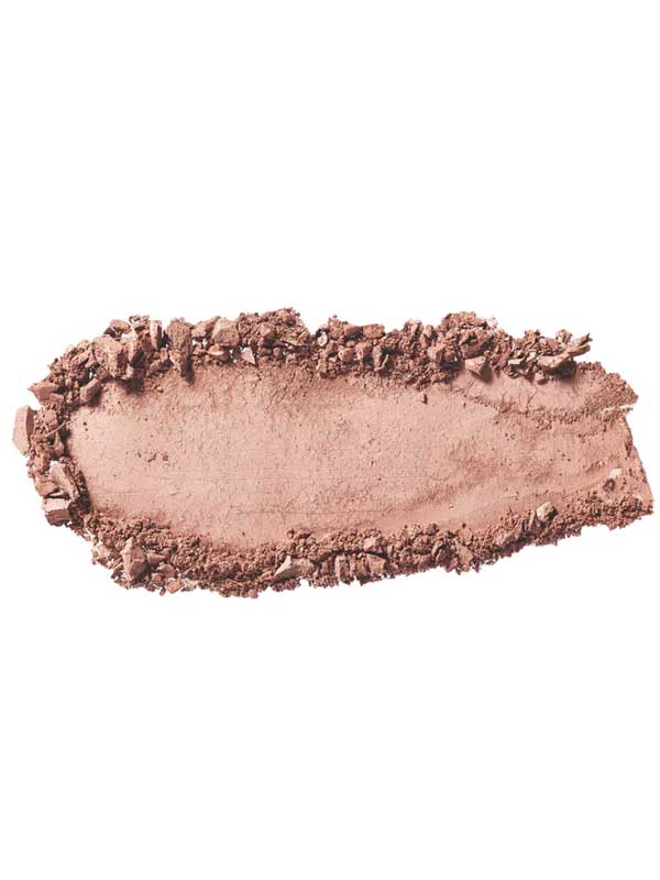 A close-up of 100% Pure Pressed Eye Shadow 2g by 100% Pure in light brown/beige, showing smudged and crumbled vegan powder with mineral shimmer scattered on a white background.