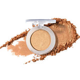 The open compact of 100% Pure Pressed Eye Shadow 2g by 100% Pure shows shimmery gold powder with a clear lid; natural mineral shimmer is swatched and scattered on a white background.