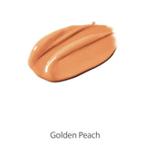 A thick swipe of creamy, peach-toned 100% Pure Cream Foundation 9g in Golden Peach sits on a white background, highlighting its luxurious texture.