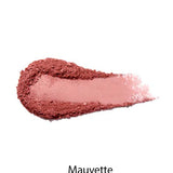 A swatch of mauve-pink 100% Pure Rice Powder Pressed Blush 9g is smeared on a white background, showing its buildable coverage for a natural flush. The word "Mauvette" appears below.