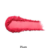 A smear of the 100% Pure Rice Powder Pressed Blush 9g in bright plum appears on a white background, with "Plum" below, showcasing its natural flush and buildable coverage.