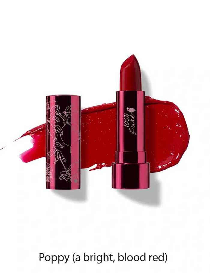 A tube of 100% Pure Pomegranate Oil Moisturising Lipstick 4.5g is shown in a floral-patterned metallic case, with a swatch of bright blood-red shade behind it. The shade is labeled Poppy (a bright, blood red).