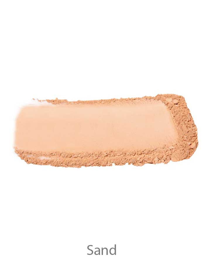 A rectangle of 100% Pure Rice Powder Foundation 9g in beige is smeared on a white background, with "Sand" labeled underneath.