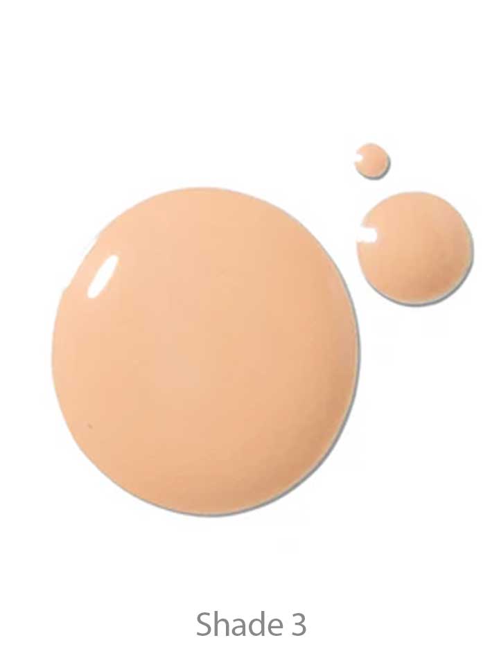 Three drops of 100% Pure 2nd Skin Foundation 35ml in a light beige shade are displayed on a white background. The antioxidant-rich serum foundation is shown as Shade 3.