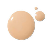 Three drops of 100% Pure 2nd Skin Foundation 35ml in Shade 4 beige rest on a white background. This serum foundation delivers an antioxidant-rich formula for a flawless finish.