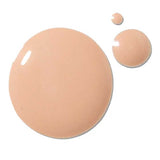Three drops of 100% Pure 2nd Skin Foundation 35ml in Shade 5 (beige) are displayed on a white background. This serum foundation has an antioxidant-rich formula, delivering a flawless finish.
