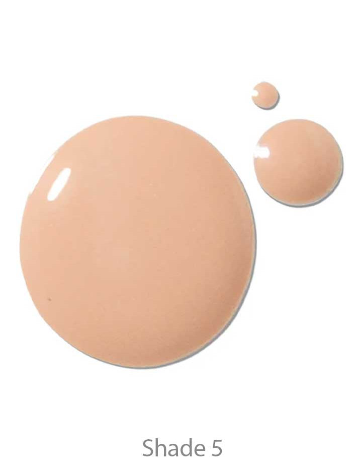 Three drops of 100% Pure 2nd Skin Foundation 35ml in Shade 5 (beige) are displayed on a white background. This serum foundation has an antioxidant-rich formula, delivering a flawless finish.