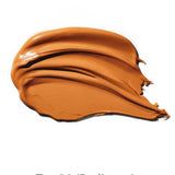 A smooth swatch of tan 100% Pure BB Cream 30ml with a creamy texture on a white background. This makeup-skincare hybrid provides radiant, glowing coverage. Text below reads Tan 30 (Radiance).